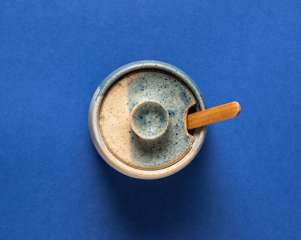 Sugar cup on blue by Jose Barrios